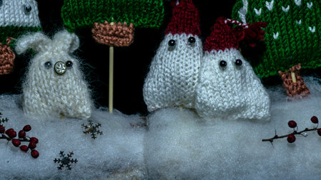 knitted gnomes, fairy tale characters, night view, color light painting photo, blurred background, craft concept, winter fairy taleの写真素材