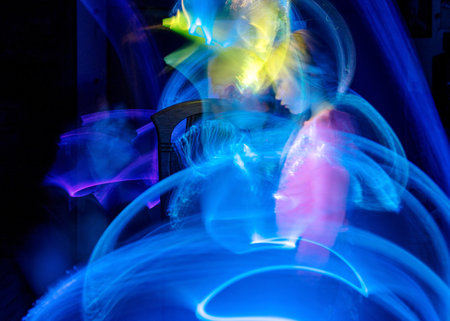 beautiful and colorful light paintings, abstract light lines and human face contours, blurred face...