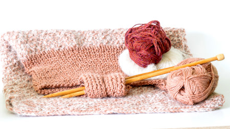 knitted work on a white background, knitted texture, needlework, home crafts
