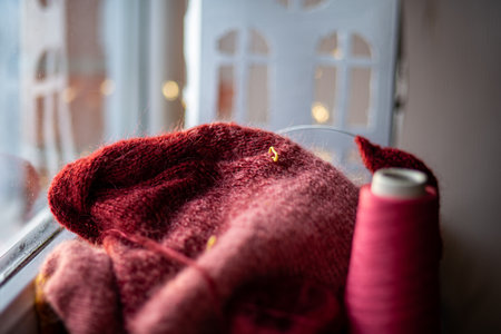 photo with unfinished knitted work, needlework concept, homemaker's work, knitting as a hobby