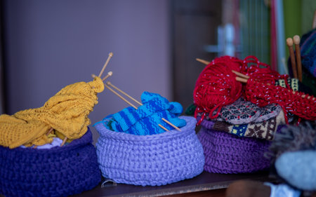 photo with unfinished knitted work, needlework concept, homemaker's work, knitting as a hobby, hobby as needleworkの写真素材