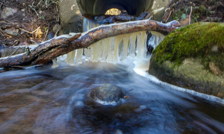 abstract landscape with icicle texture on the background of running waterの写真素材