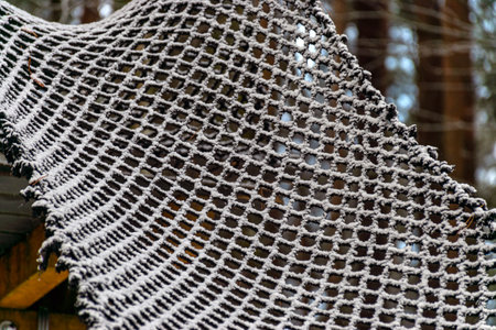 abstract snowy net texture, white net in winter, snow