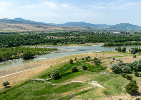wide landscape with fields, sky, water, hills, Georgia, summerの写真素材