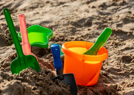 children's plastic toys on the beach, water and sand toys, summer recreation