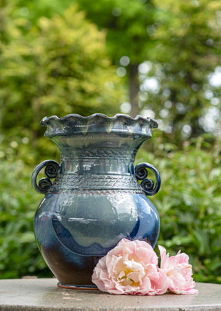 still life with a clay vase, decorative clay dishes, handmade, craftsman concept, interior items, home and garden decorの写真素材