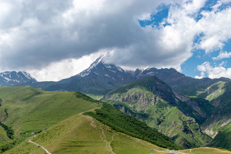 beautiful mountain landscape, clouds cover mountain peaks, Kazbek, Georgia, summer