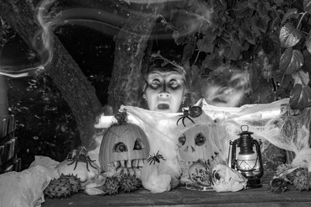 scary Jack O Lantern Halloween pumpkins in the dark, carved pumpkins with different scary faces...