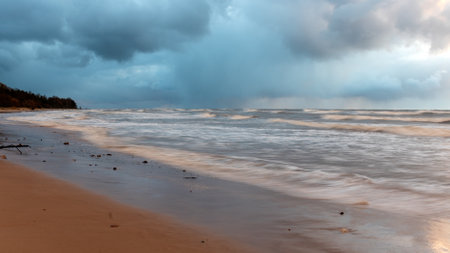 dramatic storm in the Baltic Sea, large waves crashing against the shore, blurred, unclear contours, rocky shore of Vidzeme, Thuja, Latviaの写真素材