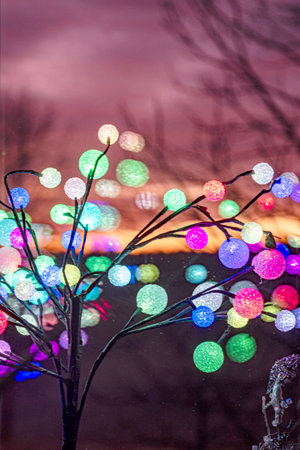 outside the window colorful sunrise sky, colorful play of light, shadows and reflections on the window glass, explosion of colors, winterの写真素材