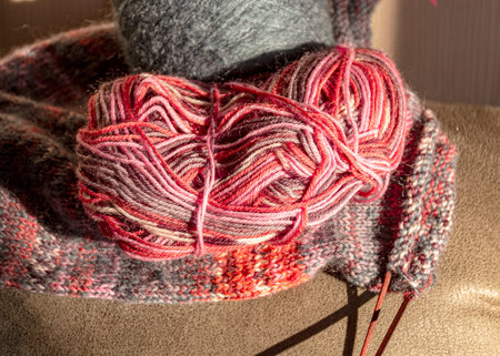 colorful knitted work in progress, handicraft concept, knit texture, wool handicrafts, hobby, winter activitiesの写真素材