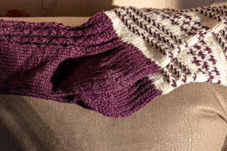 colorful knitted work in progress, handicraft concept, knit texture, wool handicrafts, hobby, winter activitiesの写真素材