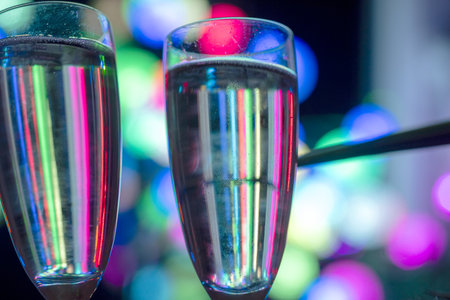 glass silhouette on a blurred and unclear, abstract, colorful, different shapes and brightness light background, holiday conceptの写真素材