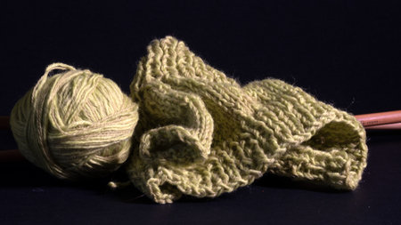 close-up of unfinished knitting, woolen threads and needles, handmade, home-made concept