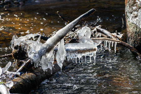 ice formations in a wild river, beautiful frozen ice formations from the interaction of water, flow and frost, Raunis, Latvia, springの写真素材