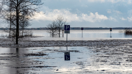 latvian winter landscape with flooded lake, thin and light ice in places, reflections, Burtnieki...