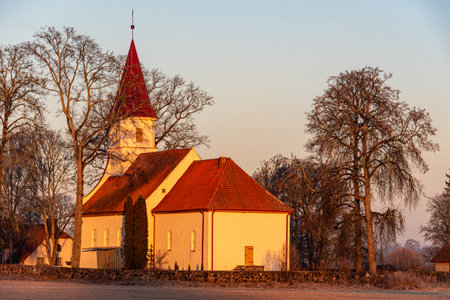 landscape with wonderful small rural church in morning light, sunrise in nature, Rubene church, Latviaの写真素材