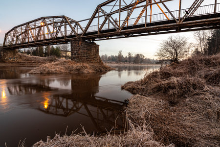 iron structure bridge over the river Gauja, popular walking spot, dawn light, Valmiera, Latvia