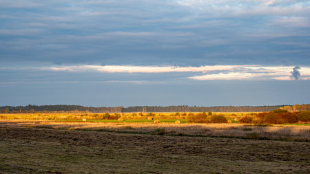 wonderful sunset, autumn landscape, the sky is reflected in the calm surface, beautiful reflections in the waterの写真素材