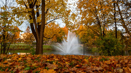 landscape with a fountain in the city park, bright colors, city park in the evening, Valmiera, Latviaの写真素材