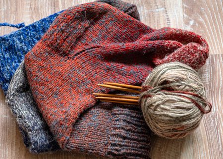 colorful knitting yarn and knitting needles, knitwear fashion, wool socks and needles, knitting...