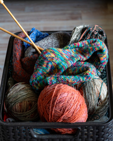colorful knitting yarn and knitting needles, knitwear fashion, wool socks and needles, knitting...