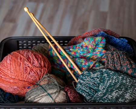 colorful knitting yarn and knitting needles, knitwear fashion, wool socks and needles, knitting...