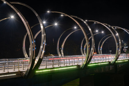 autumn landscape with colorful bridge lighting, evening twilight, blurred light objects, bridge over...