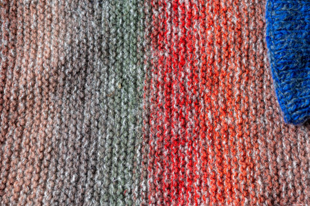 knitted finished work, knit texture, knitwear fashion, wool socks and needles, knitting hobby, needlework clothing, needlework conceptの写真素材