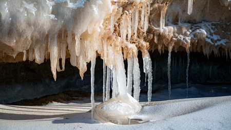 Wonderful view of the frozen sea coast in winter, pieces of ice of different sizes, ice-covered...