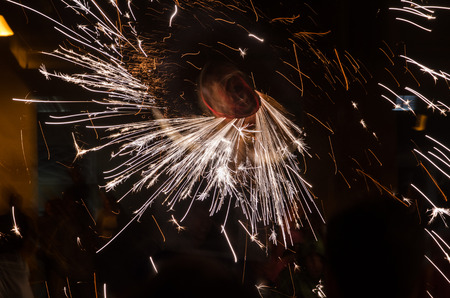 Several white sparks and the fire bull roulette moving.の写真素材