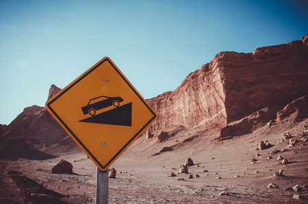 Desert crests following big slope car signal in Atacama, Chileの写真素材