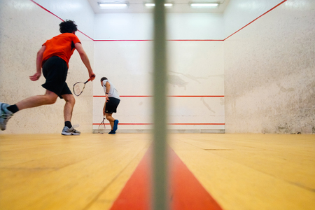 Two friends having good sport time playing squash in Mutilva, Navarra, Spainの写真素材