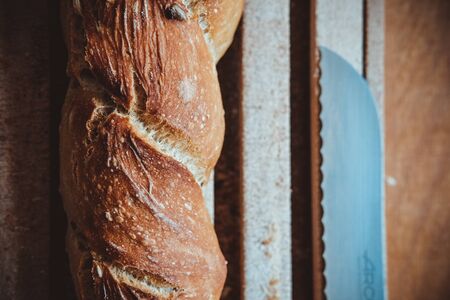 Artisanal bread stick on wood tableの写真素材