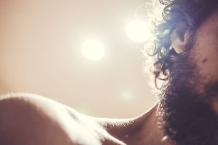 Caucasian male showing curly dark beard starting the become whiteの写真素材