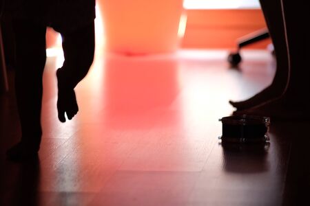 Mother and children barefoot playing at homeの写真素材