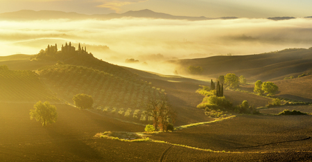 the famous Tuscan landscape at sunriseの写真素材