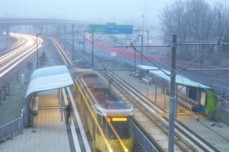 morning, intensive traffic on the urban road thoroughfare in difficult road conditions, fog and...