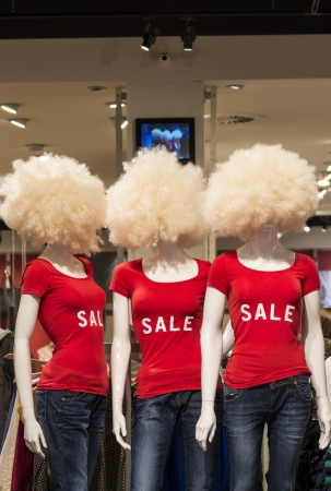 three window dummys with sale on shirtの写真素材