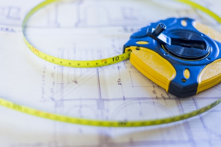 planning and measuring concept, measuring tape on building plan.の写真素材