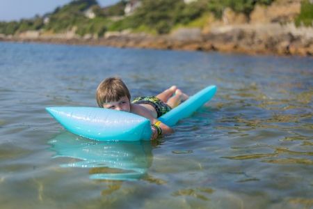 boy  on inflatable mattressの写真素材