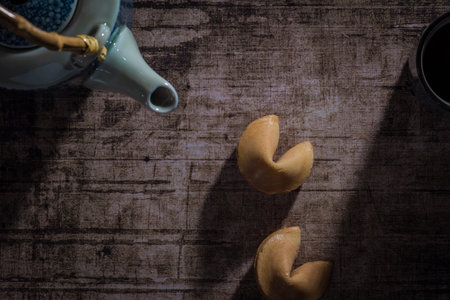 top view of tea with two unopened fortune cookies, your destiny is not yet decided.