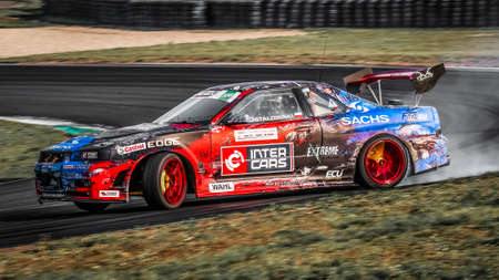 Oschersleben, Germany, August 30, 2019: Polish driver Bartosz Ostalowski driving his Nissan Skyline R34 LS3 during the Drift Kings International Series at Motorsport Arena in Germany.のeditorial素材
