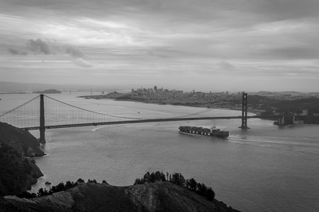 San Francisco, California, United Sates of America - January 14, 2016 : A container ship arrives in San Francisco on a stormy grey day.のeditorial素材