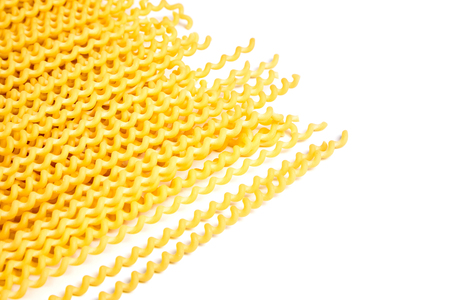 Raw fusilli bucati lunghi italian pasta on white backgroundの写真素材