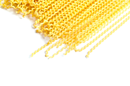 Raw fusilli bucati lunghi italian pasta on white backgroundの写真素材