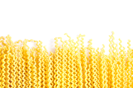 Raw fusilli bucati lunghi italian pasta on white backgroundの写真素材