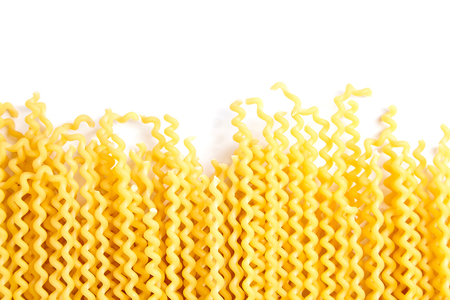 Raw fusilli bucati lunghi italian pasta on white backgroundの写真素材