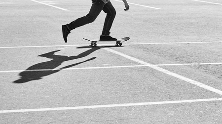 Shadow of a skateboarder on asphalt. Black and white imageの写真素材