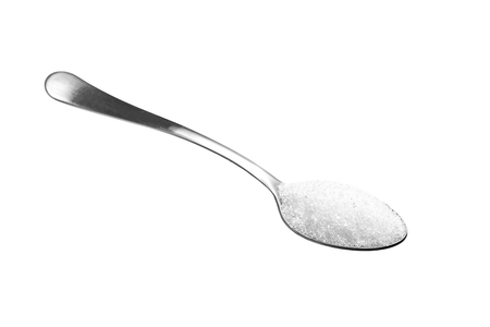 a teaspoon of stainless steel with white sugar, isolated on white backgroundの写真素材